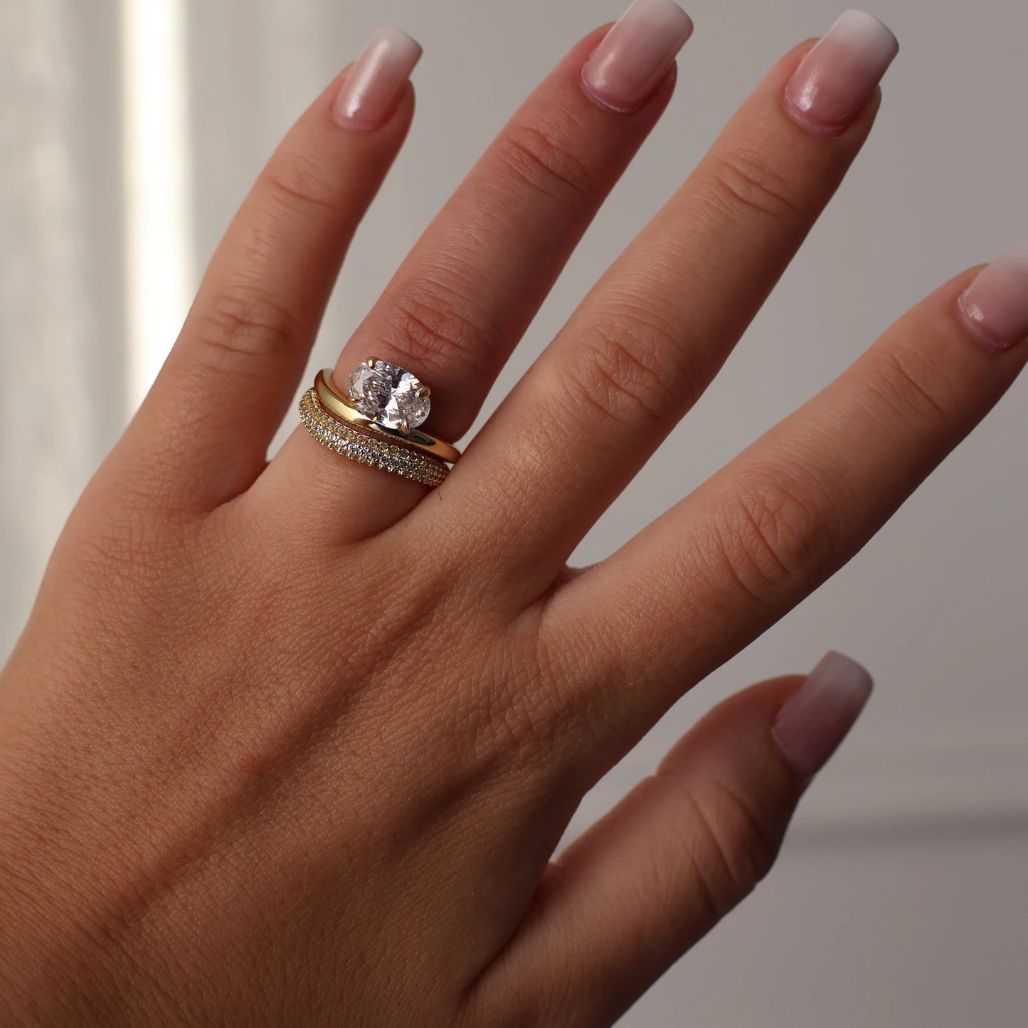 East west oval gold wedding ring set