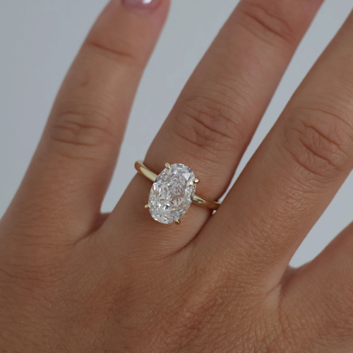 14k gold oval ring on hand