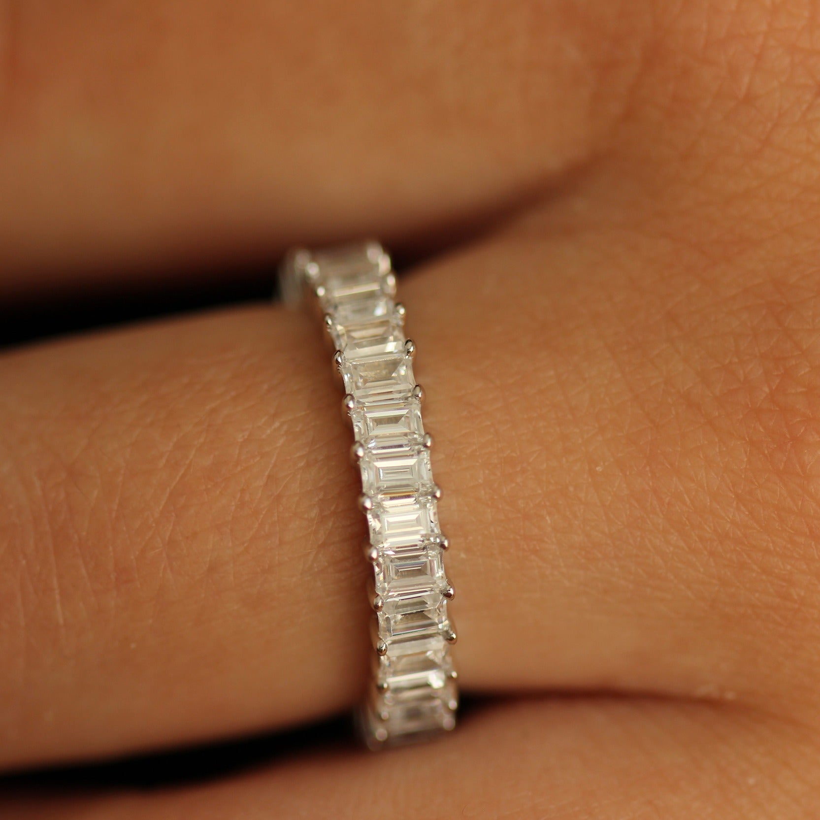 3mm cubic zirconia emerald eternity band on hand