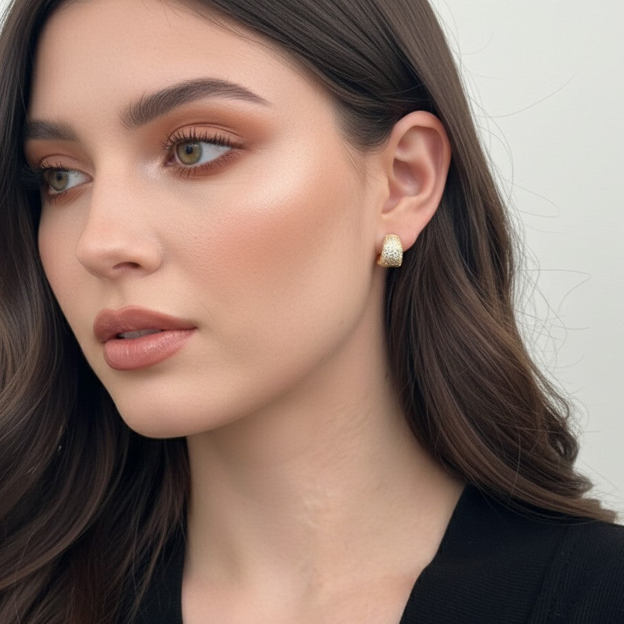 gold dome hoop earrings on model