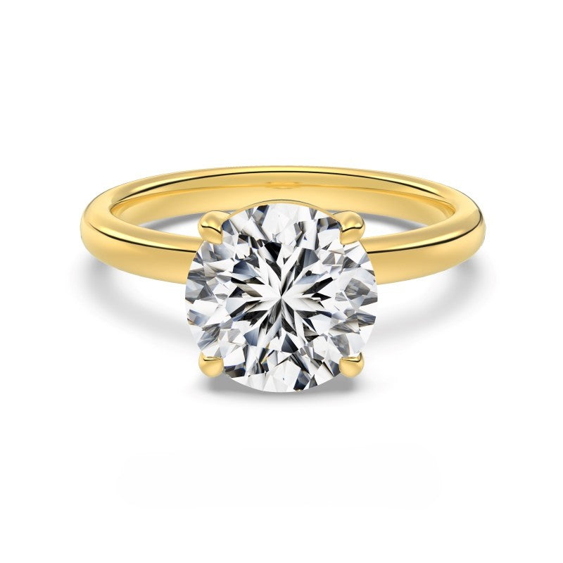 3 carat round cut gold ring on white background
