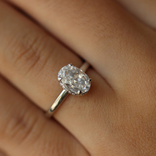 Silver oval ring on hand