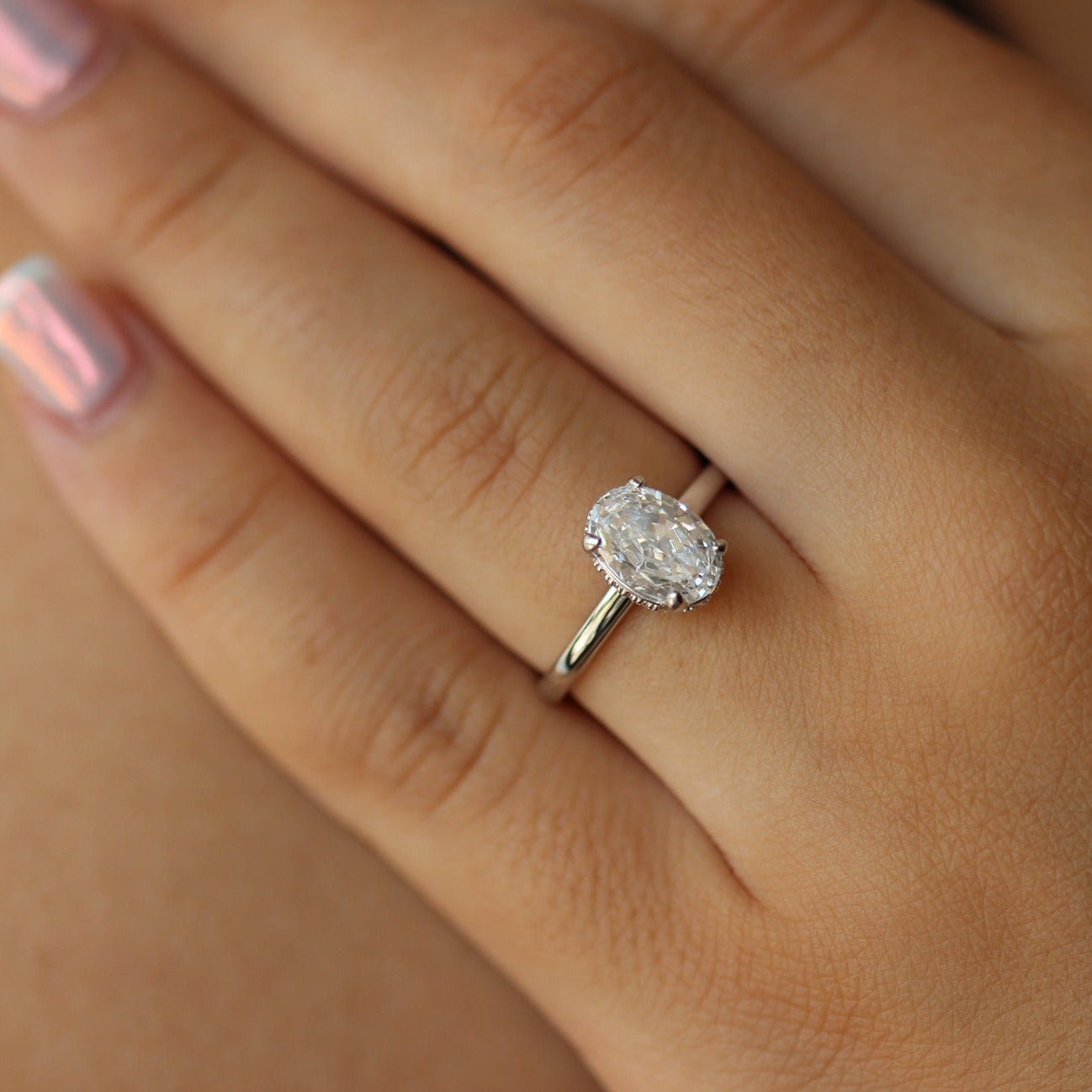 Silver oval ring on hand