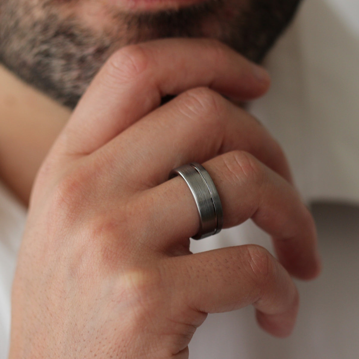 mens silver offset line ring model chin pose