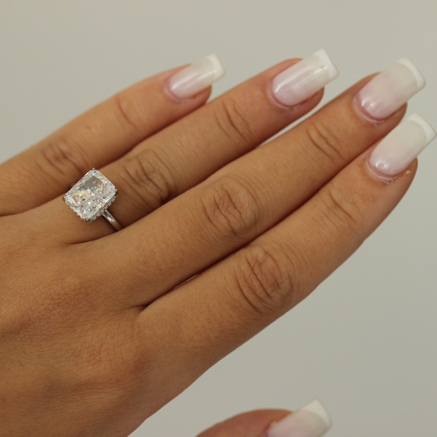 silver radiant ring on hand