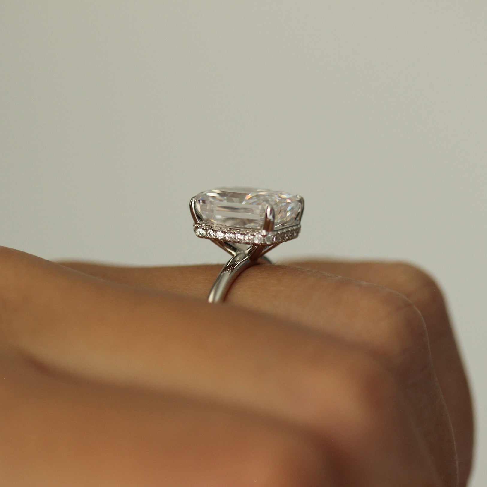 silver radiant ring side profile on hand