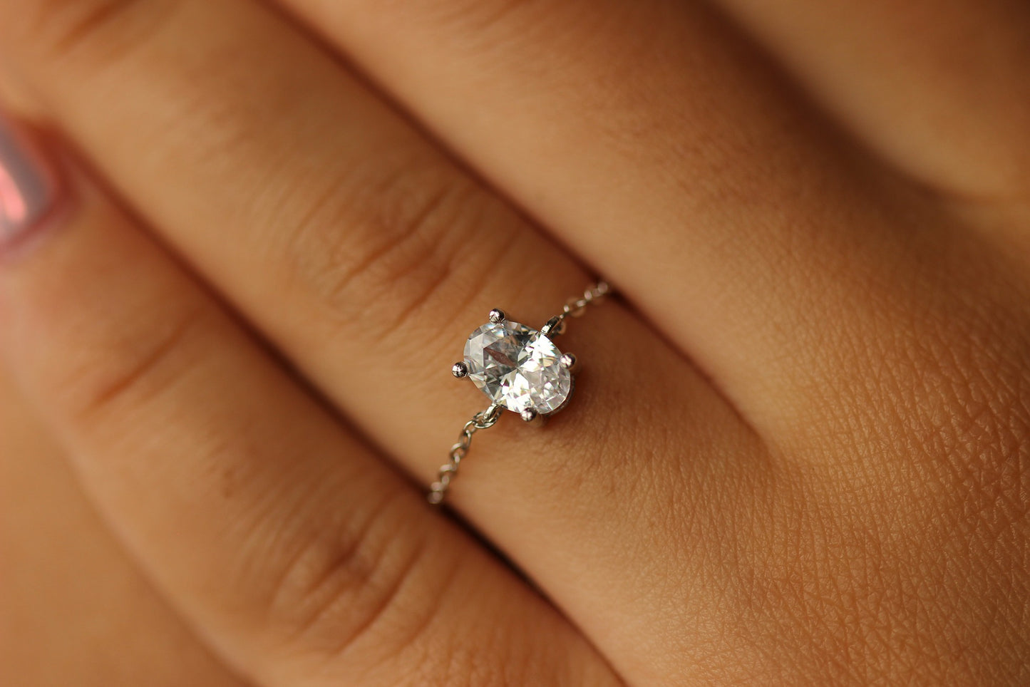 Oval adjustable silver ring on hand