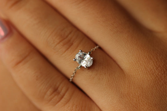 Oval adjustable silver ring on hand