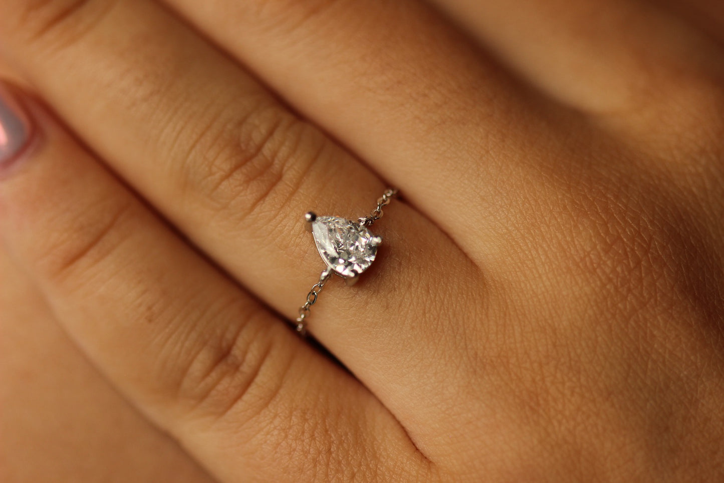 Pear adjustable silver ring on hand