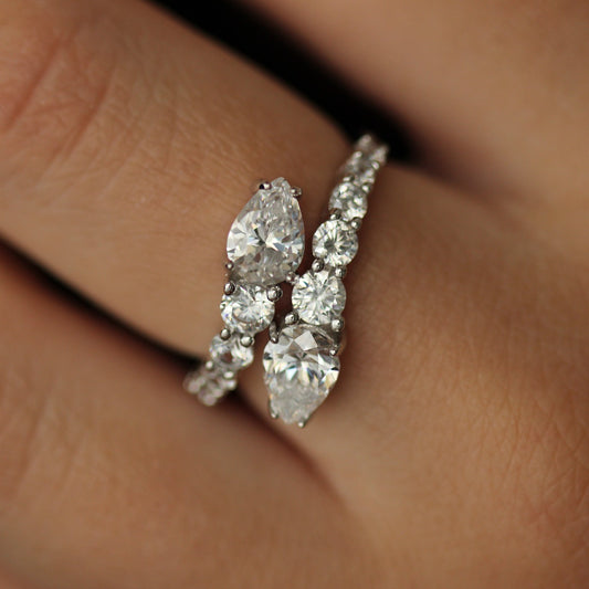 cubic zirconia ring with pear overlapping design on hand