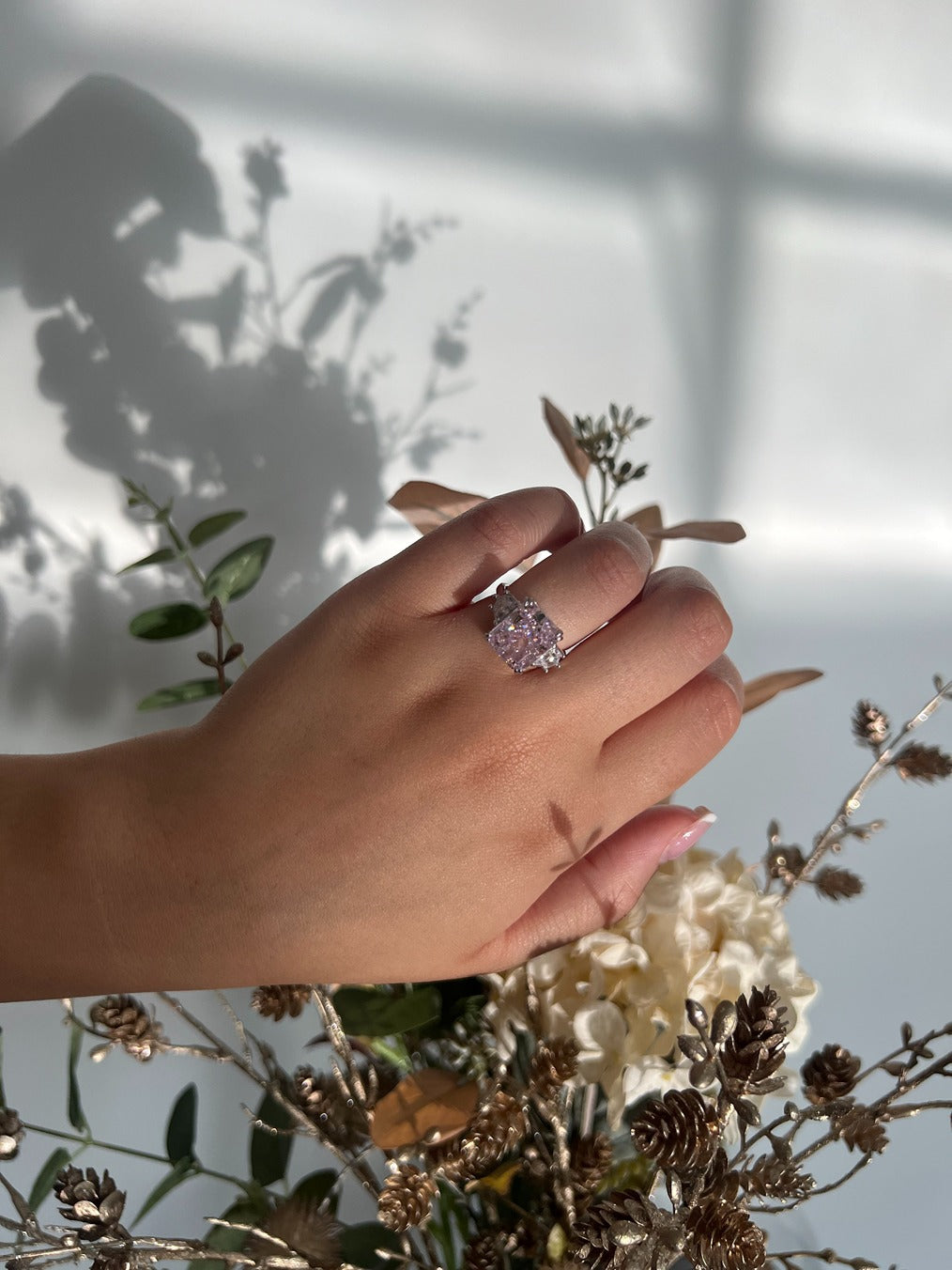 silver rectangle travel ring with pink centre stone