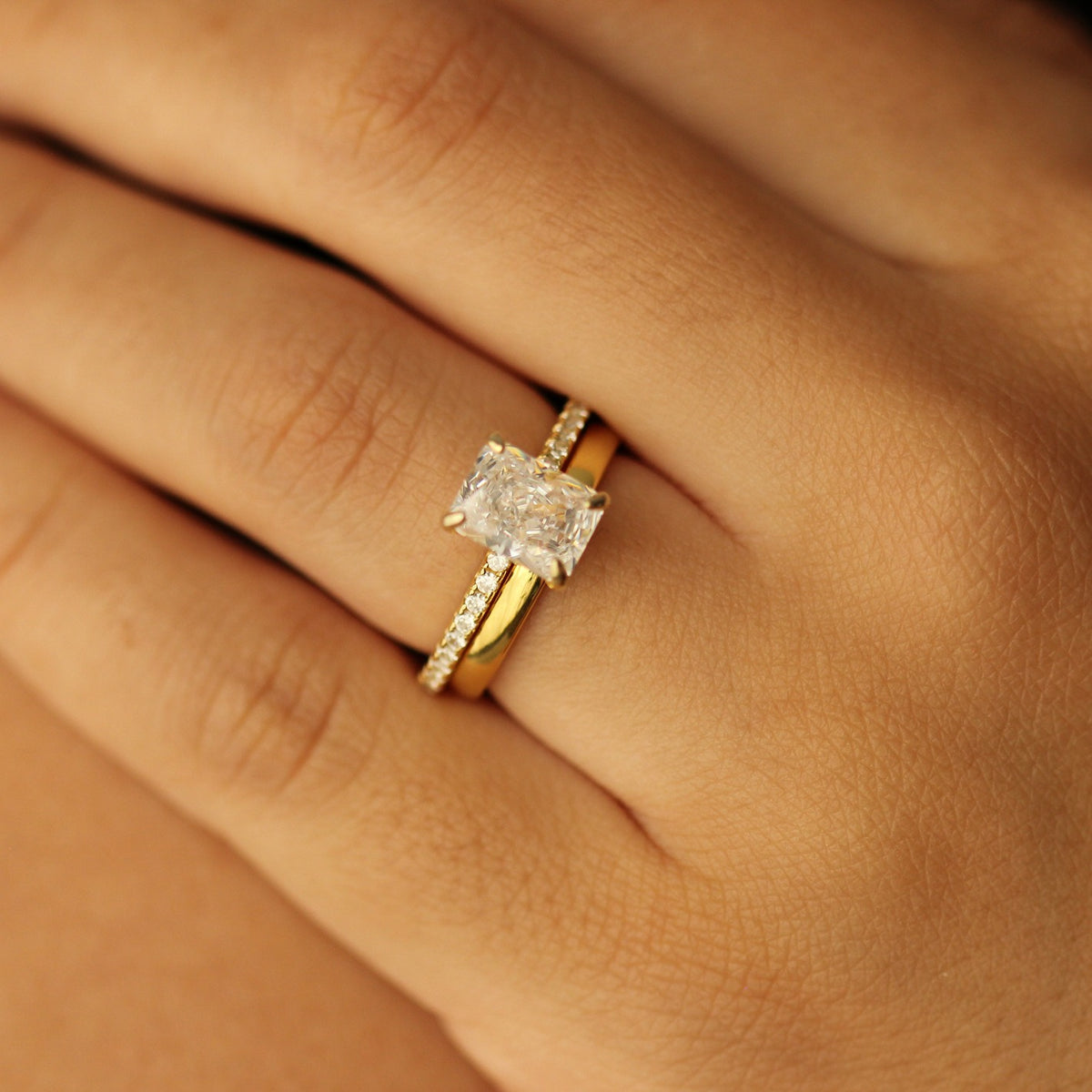 18k Plain gold wedding band with radiant cut ring on hand