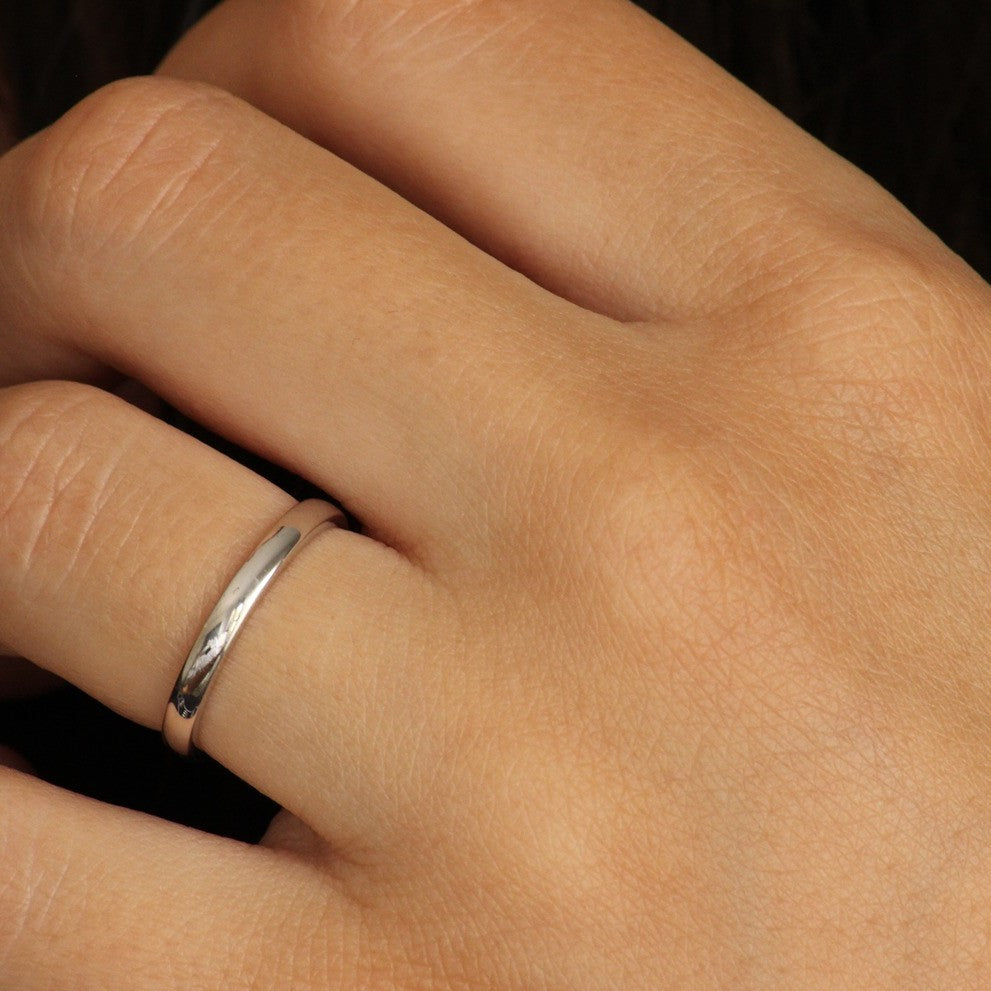 girl posing with silver wedding band