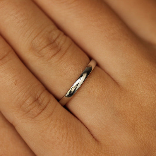 girl posing with silver wedding band