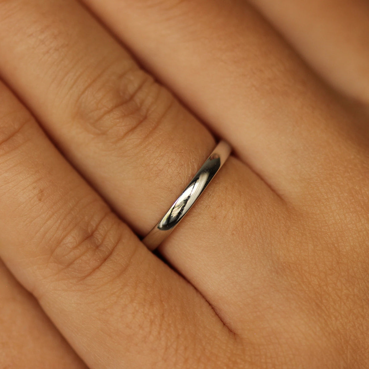 girl posing with silver wedding band