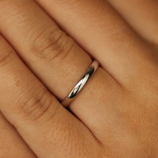 girl posing with silver wedding band