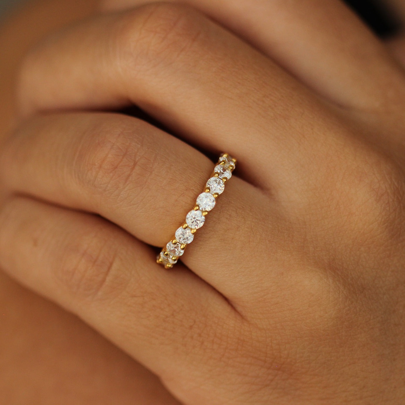 pristina gold eternity stacker ring 3mm on finger