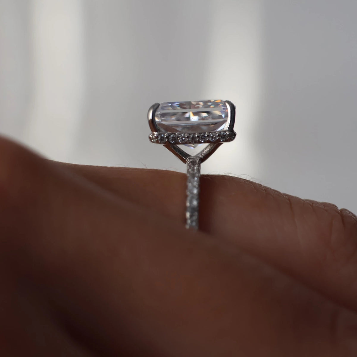 3.5 carat radiant cut CZ ring with hidden halo and pavé band