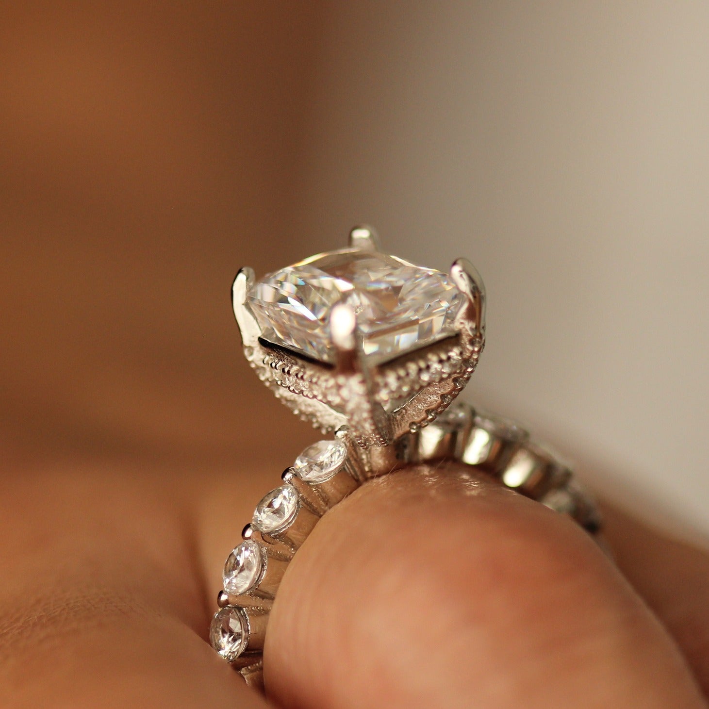 radiant cut ring with large cz stone centre on hand side profile