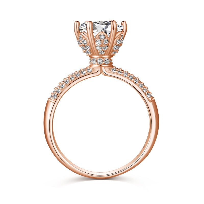 rose gold ring with round stone centre with cubic zirconia stones on band