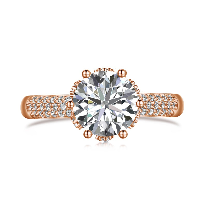 rose gold ring with round stone centre with cubic zirconia stones on band