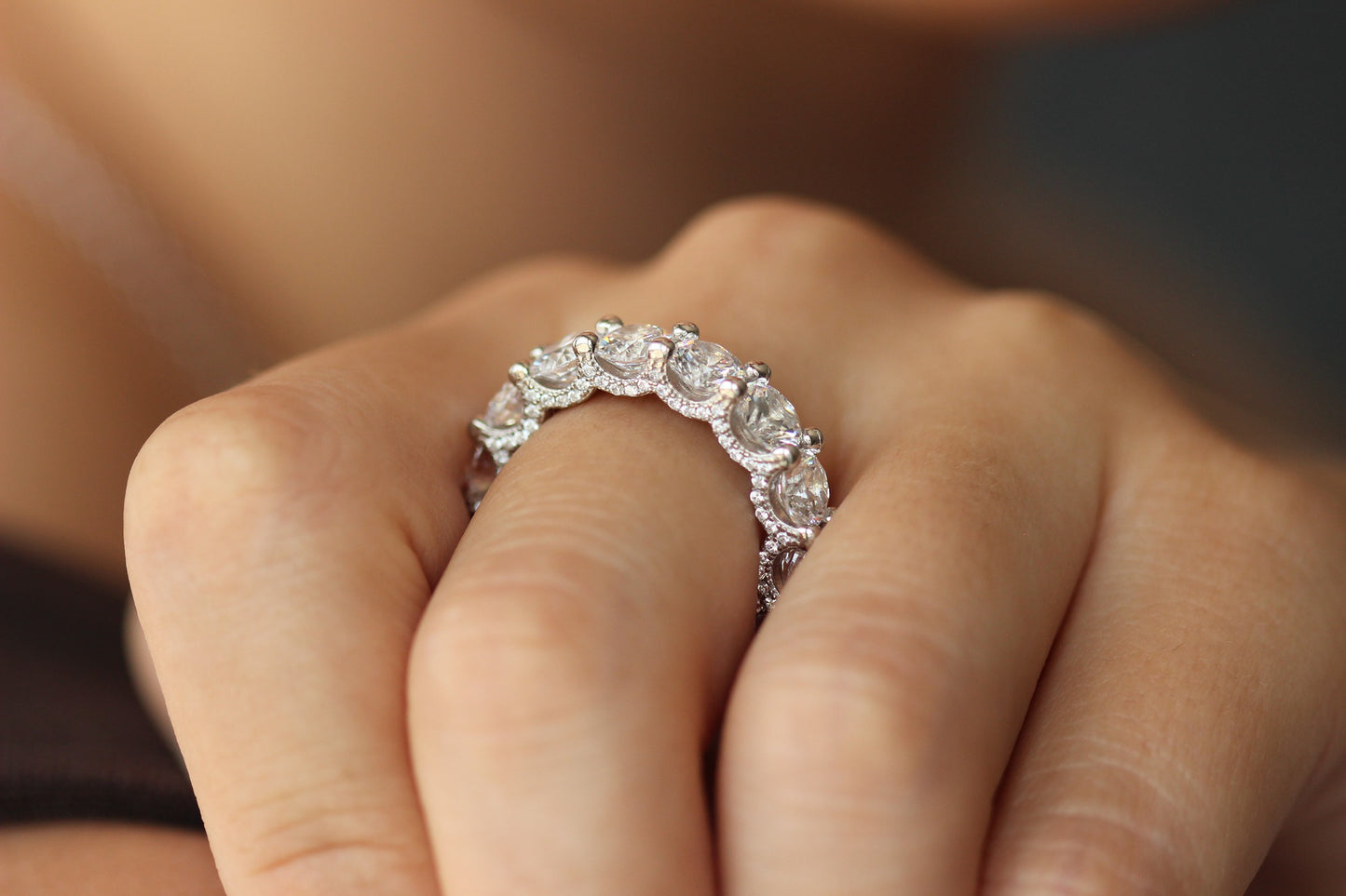 round silver stacker ring on hand side profile