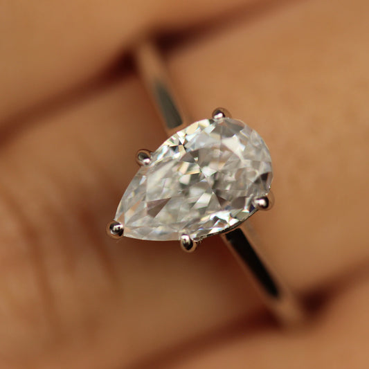 engagement pear shaped ring silver on hand