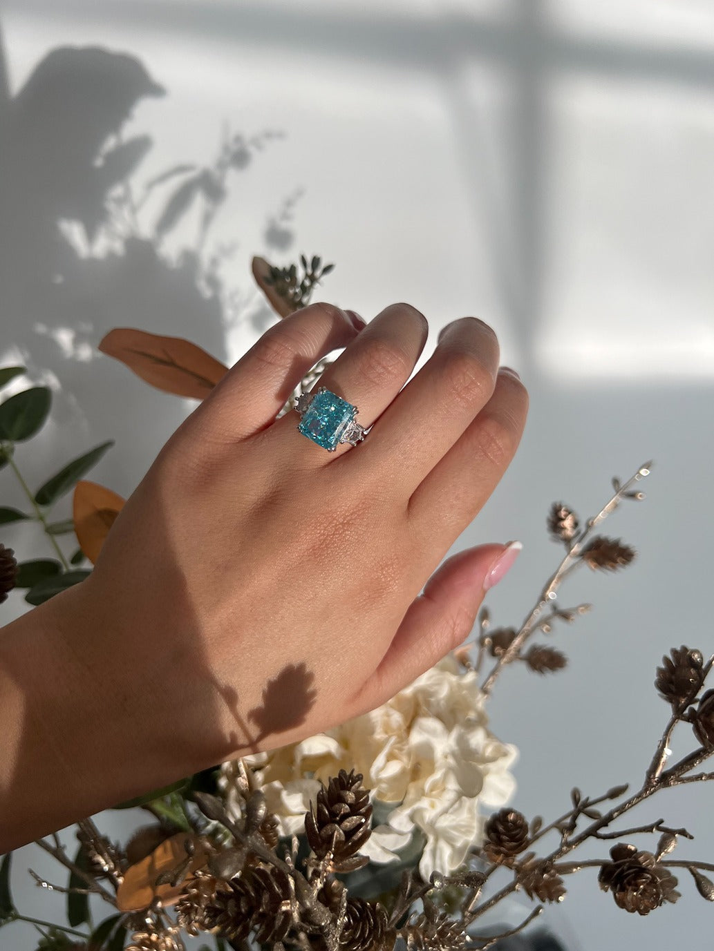 silver rectangle ring with blue cubic zirconia stone