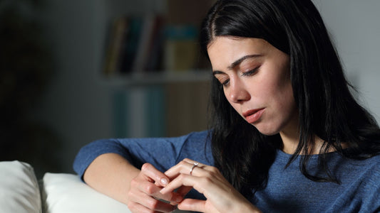 women thinking about her cubic zirconia ring