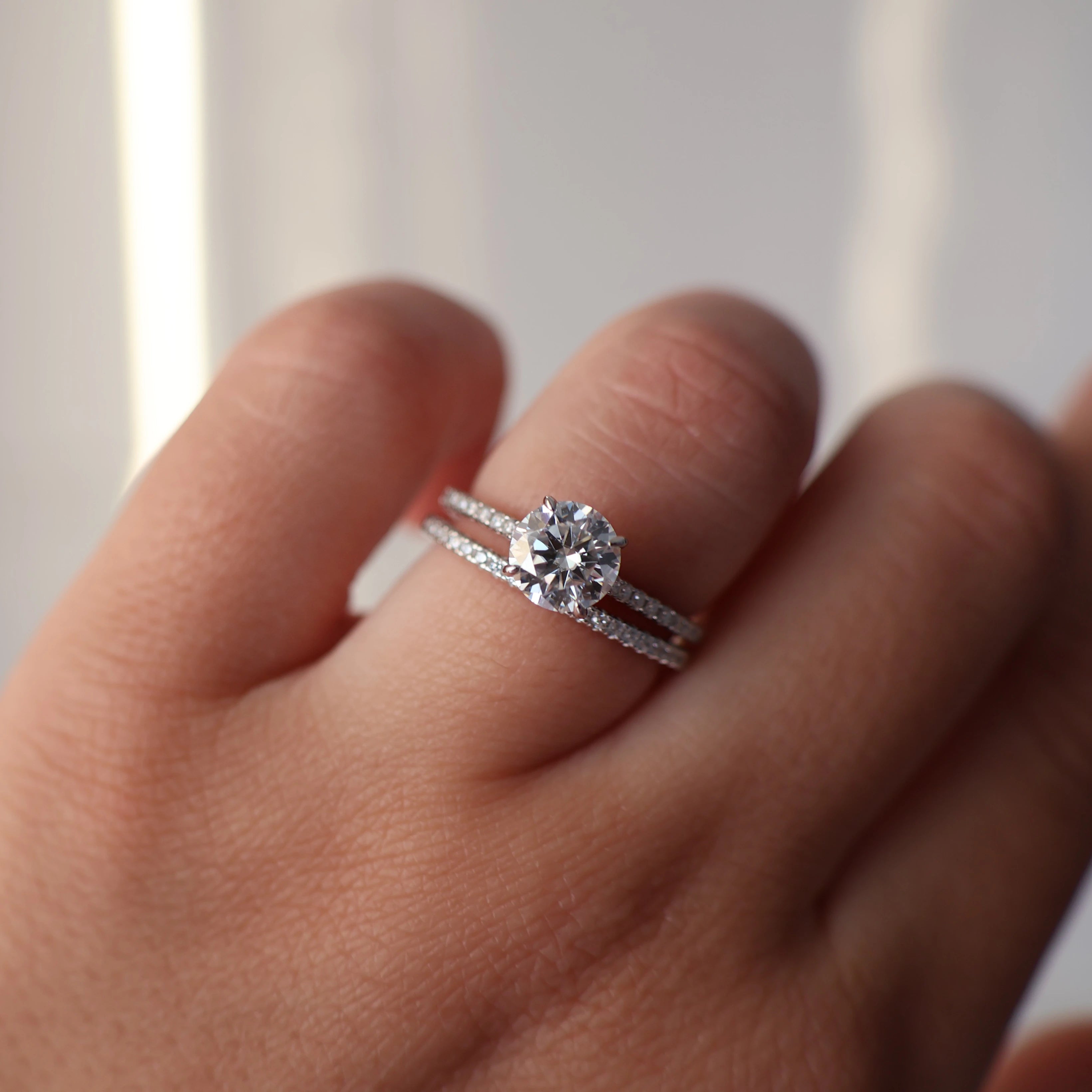 1 carat pavé set moissanite ring stacked with a half pavé band
