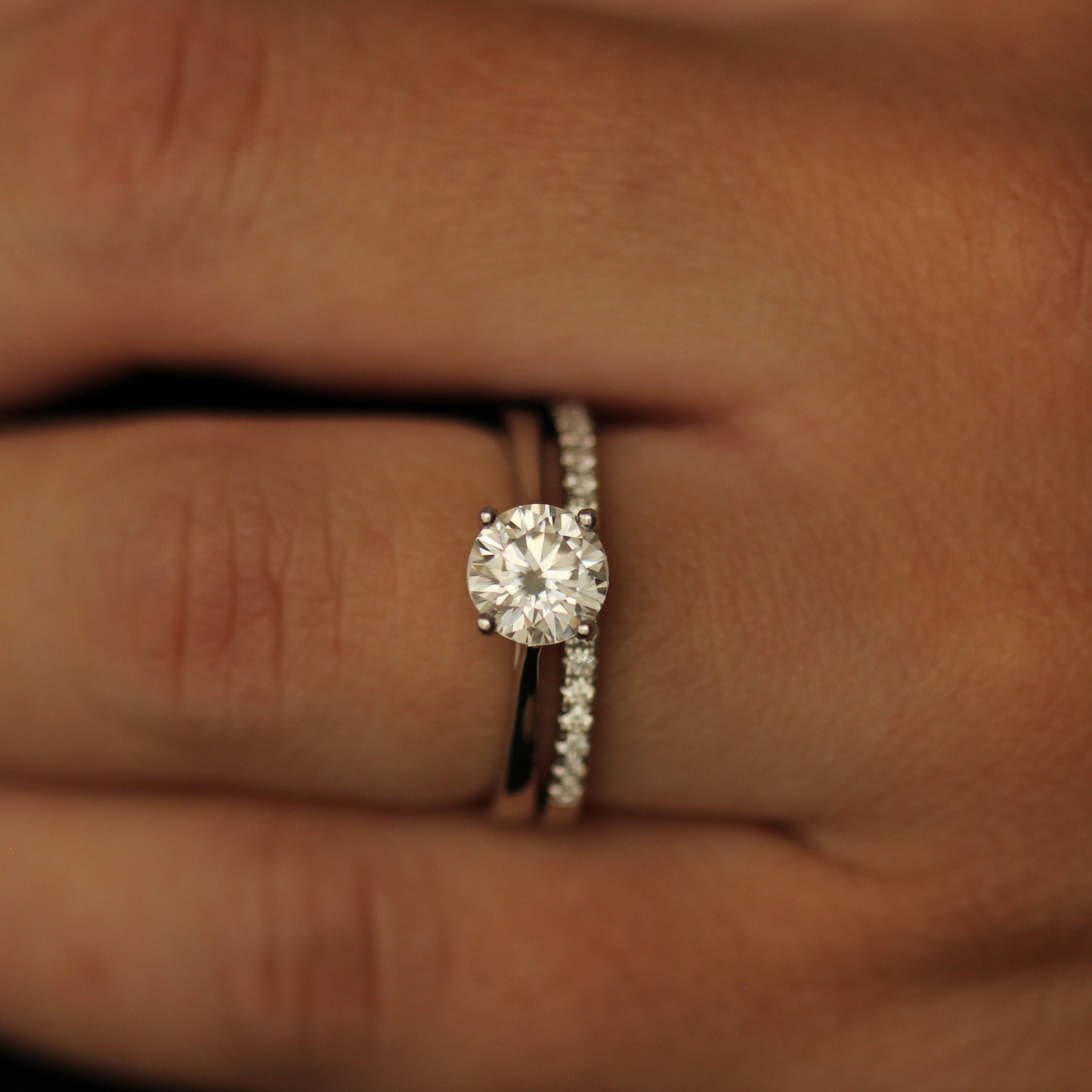 1 carat round moissanite solitaire engagement ring in a silver band