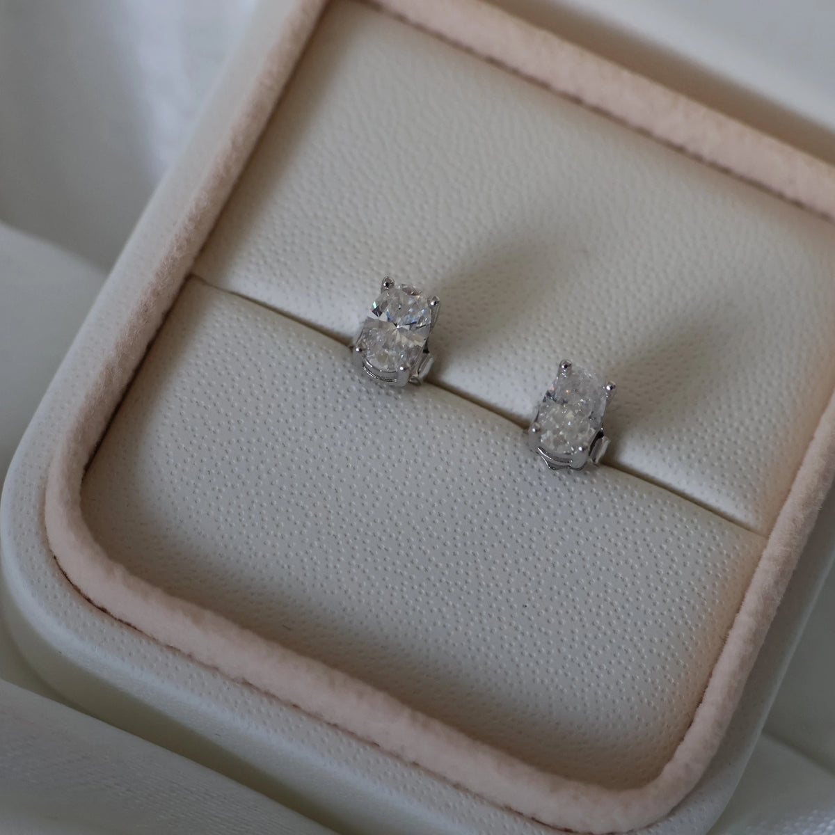 1 TCW oval moissanite stud earrings in silver