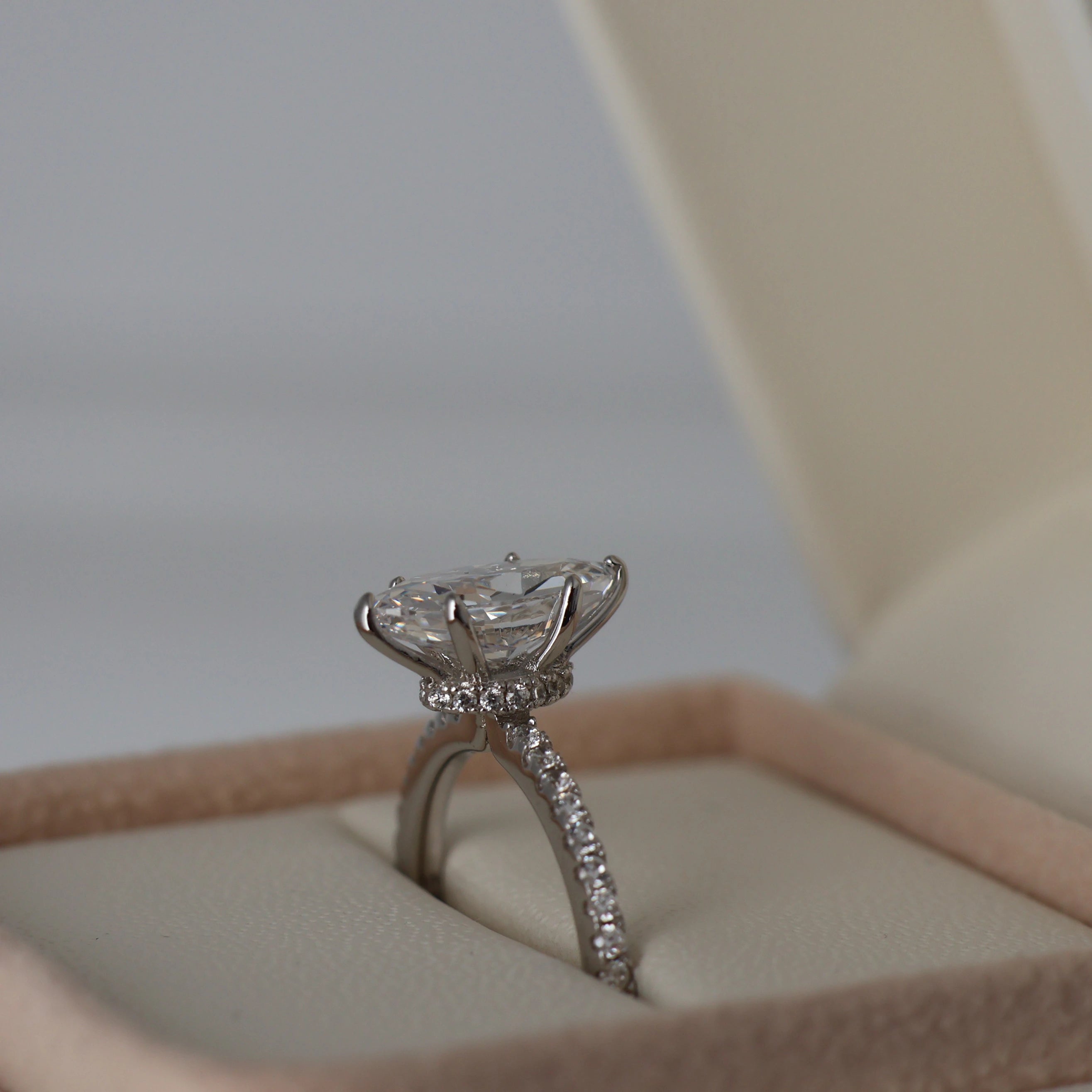 1.5 carat marquise cut cubic zirconia ring with a hidden halo and pavé band in silver