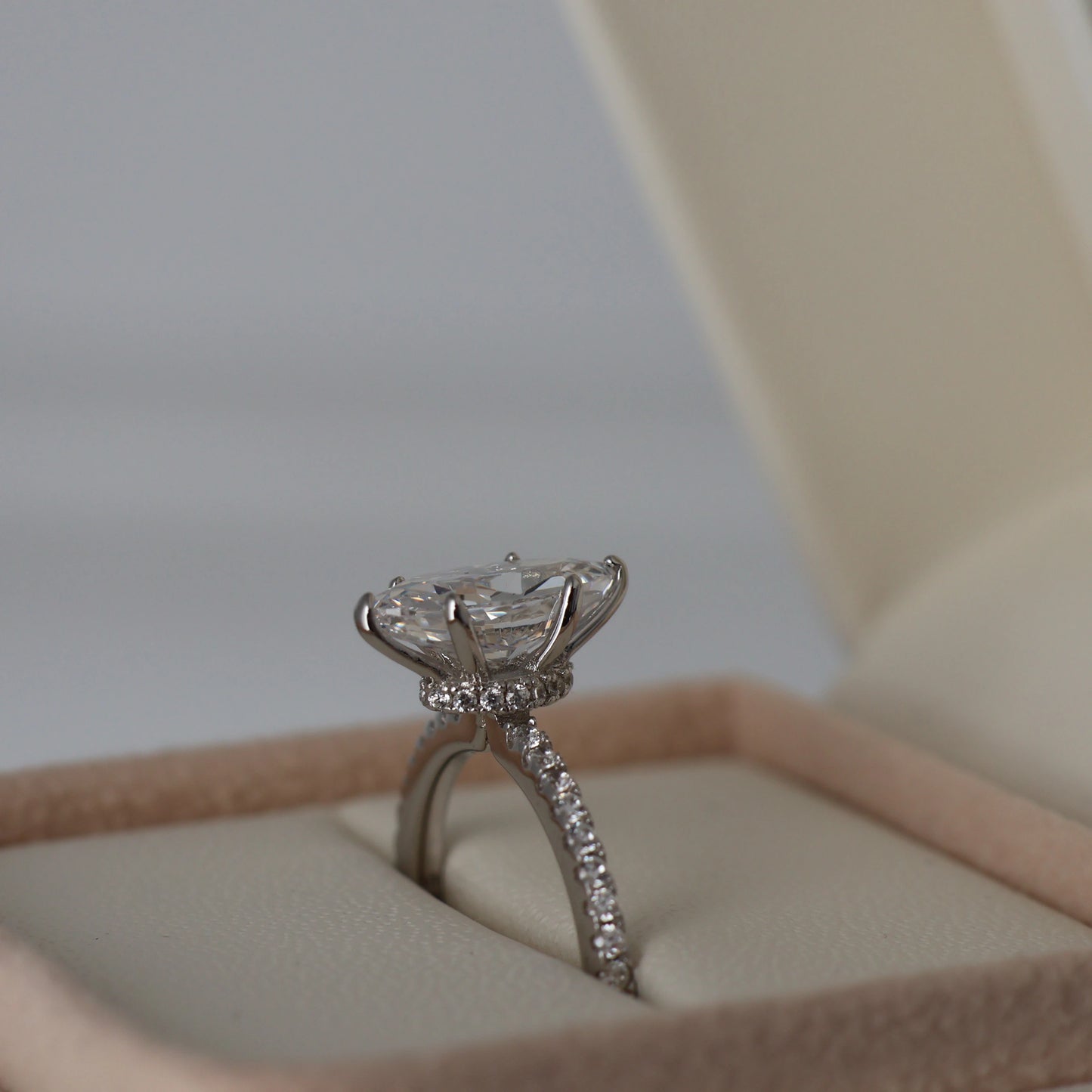 1.5 carat marquise cut cubic zirconia ring with a hidden halo and pavé band in silver