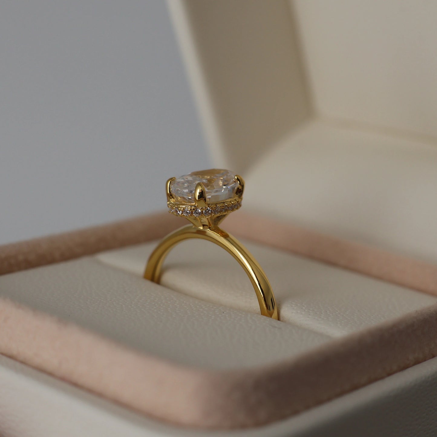 1.5 carat oval cut cubic zirconia ring with a hidden halo in 18k gold plating