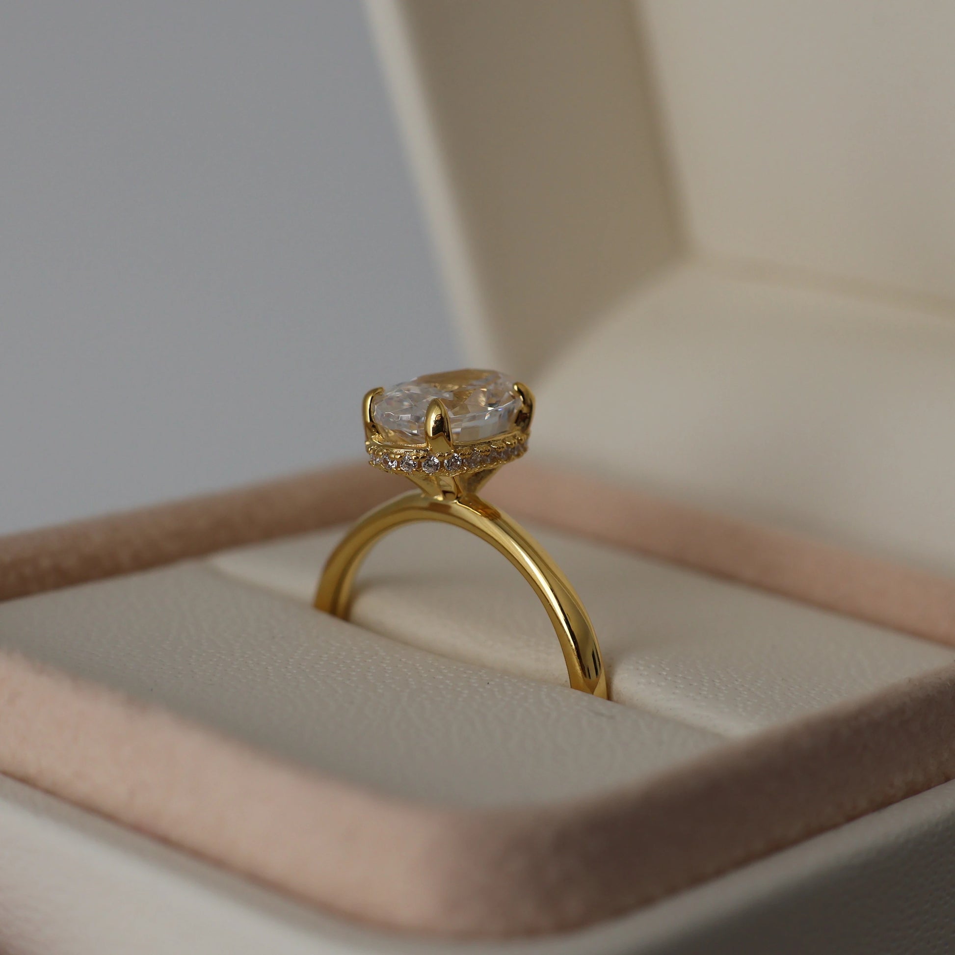 1.5 carat oval cut cubic zirconia ring with a hidden halo in 18k gold plating