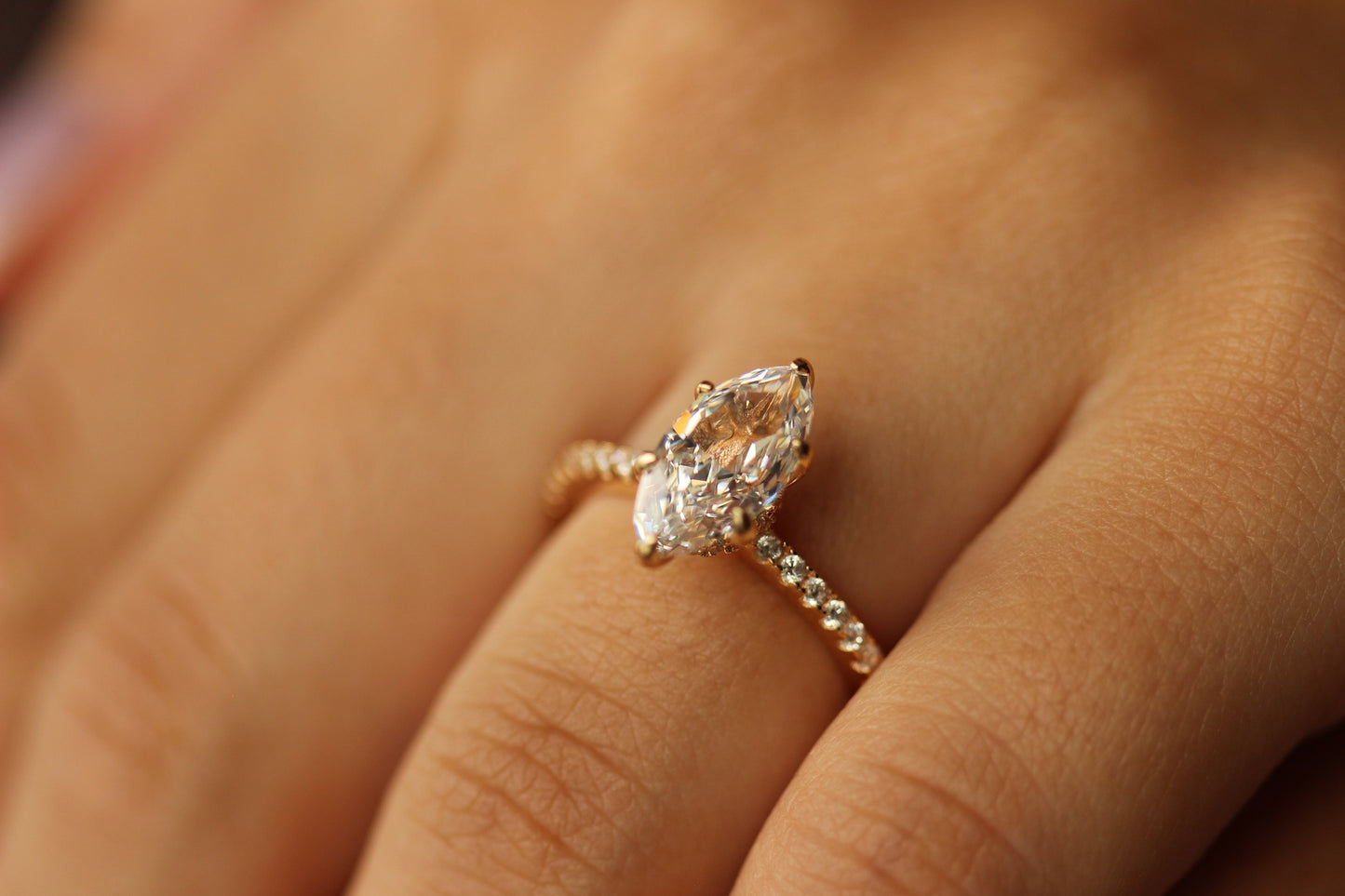marquise ring in champagne gold on pavé band