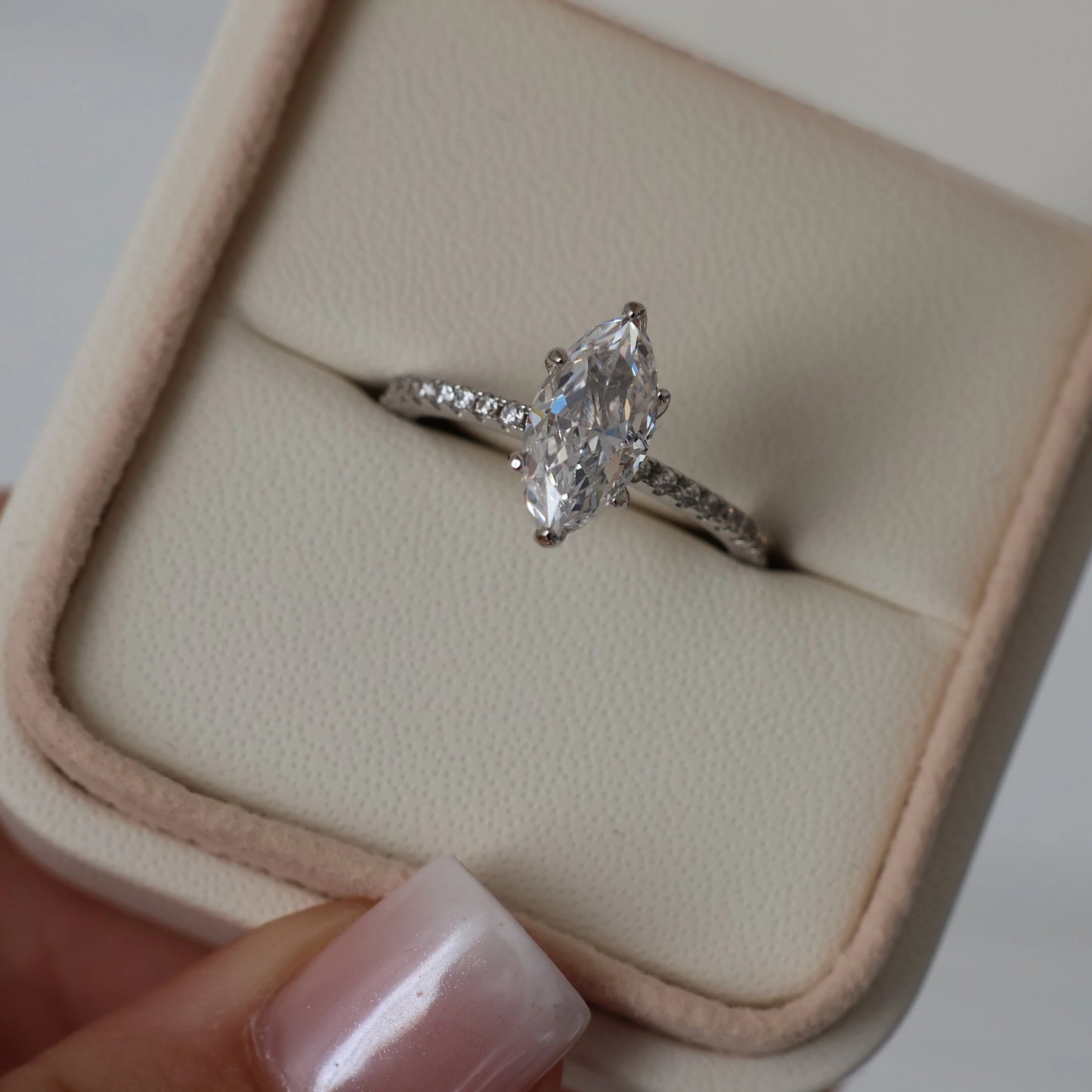 1.5 ct marquise cut cubic zirconia ring with a hidden halo and pavé band in silver