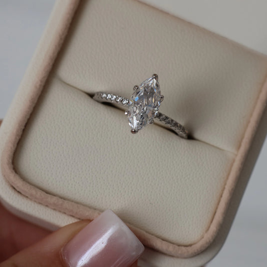 1.5 ct marquise cut cubic zirconia ring with a hidden halo and pavé band in silver