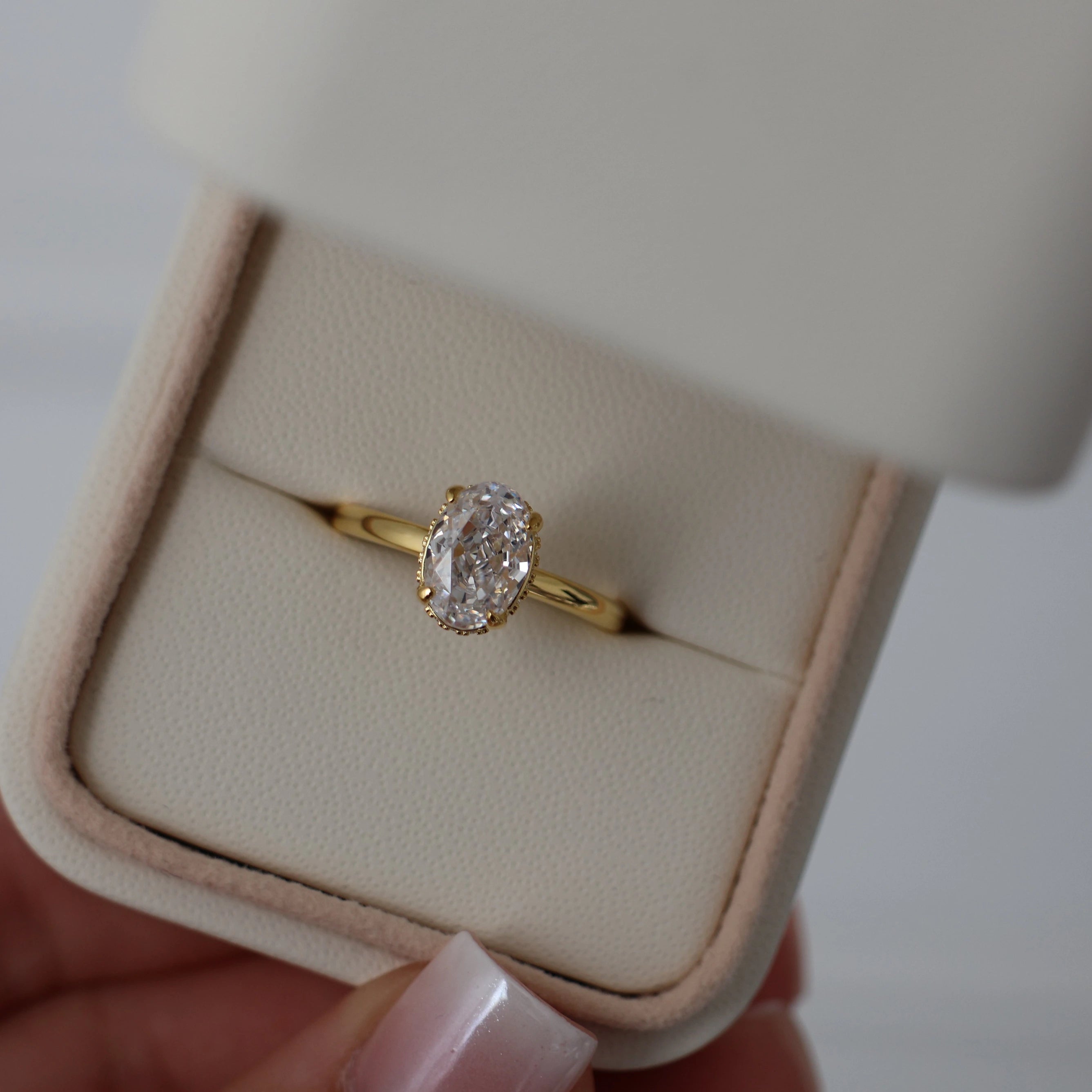 1.5 ct oval cut cubic zirconia ring with a hidden halo in 18k gold plating