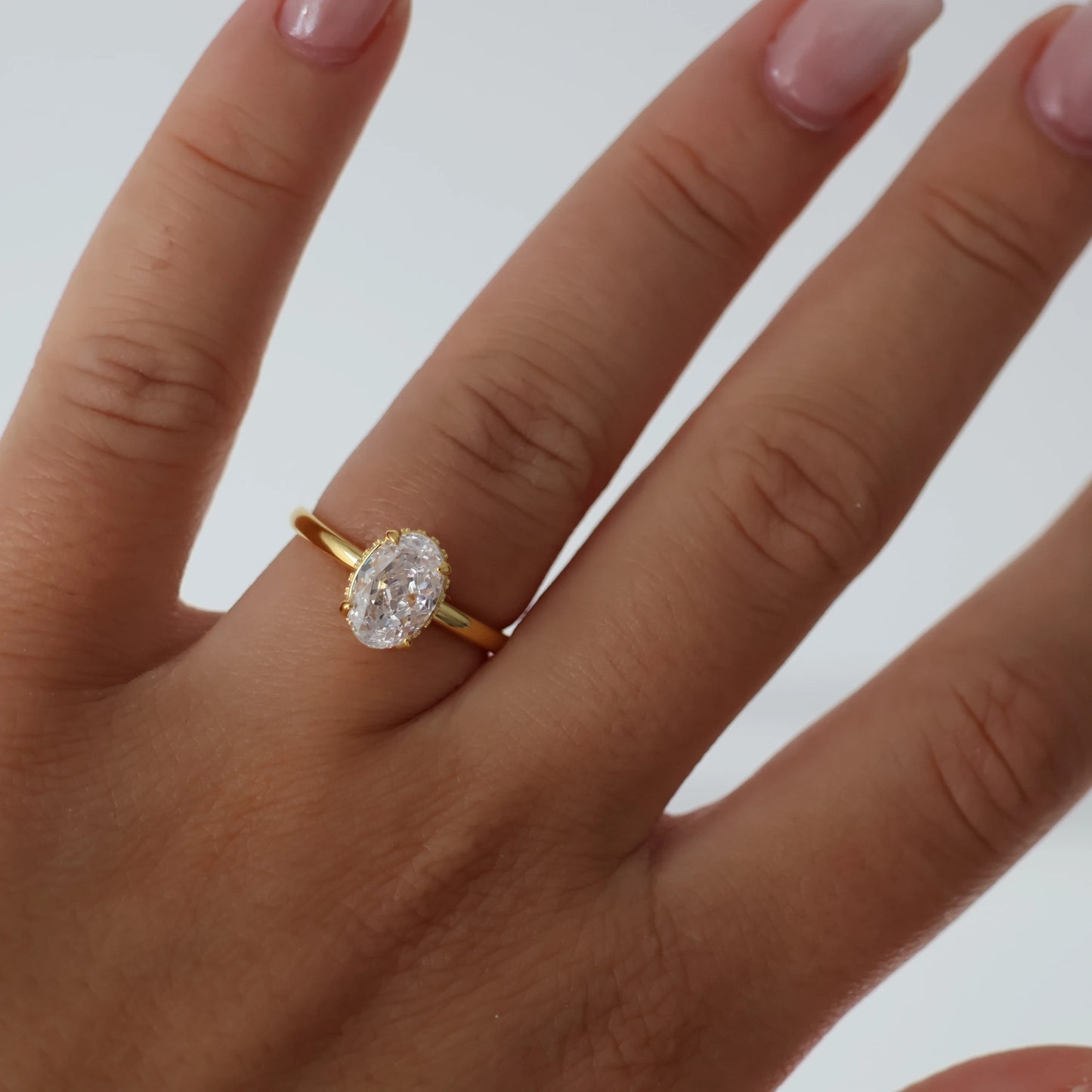 1.5 carat oval ring with hidden halo in gold