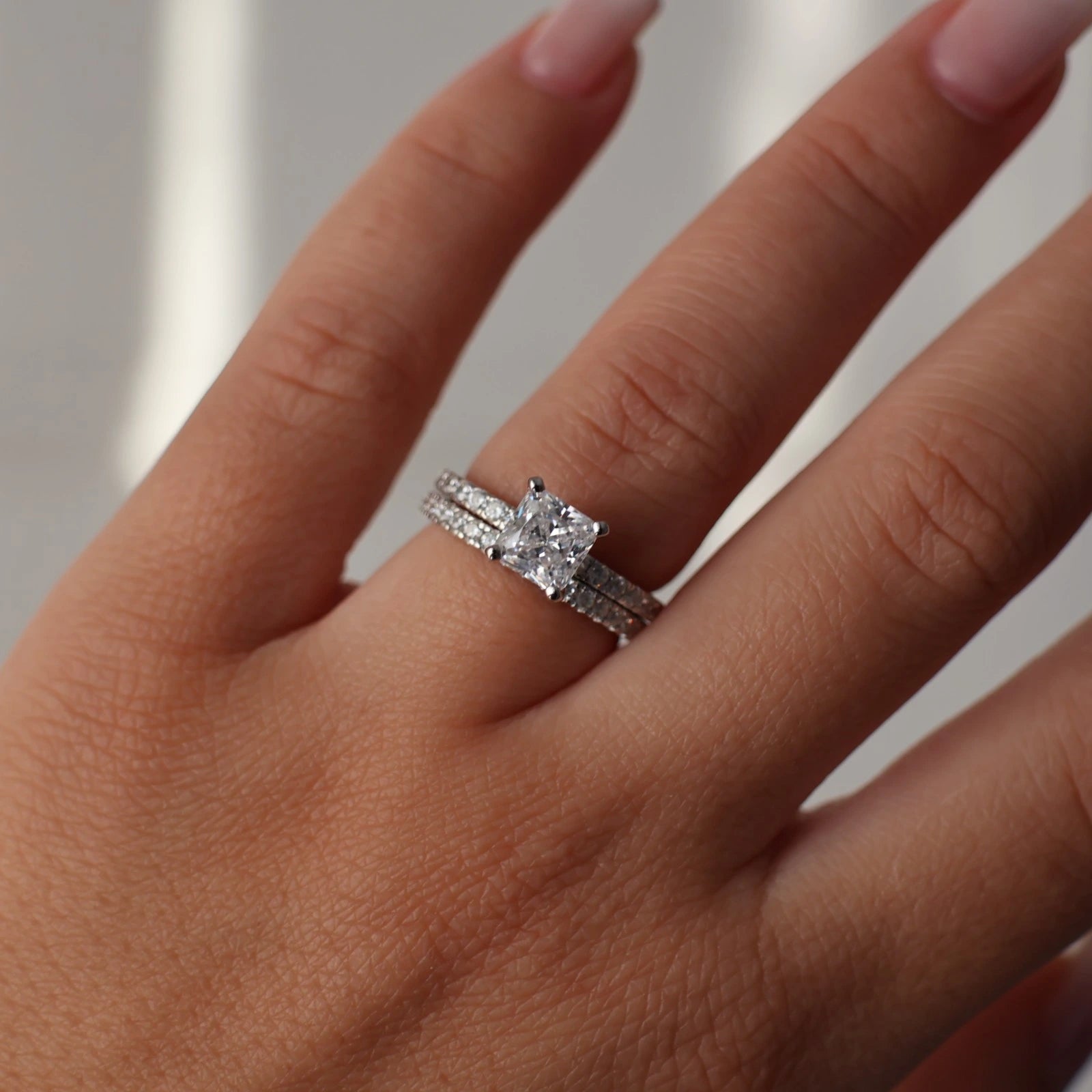1.5 carat princess cut silver ring with pave band stacked with eternity band