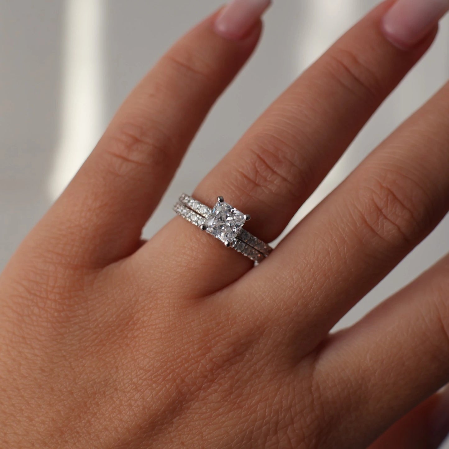 1.5 carat princess cut silver ring with pave band stacked with eternity band