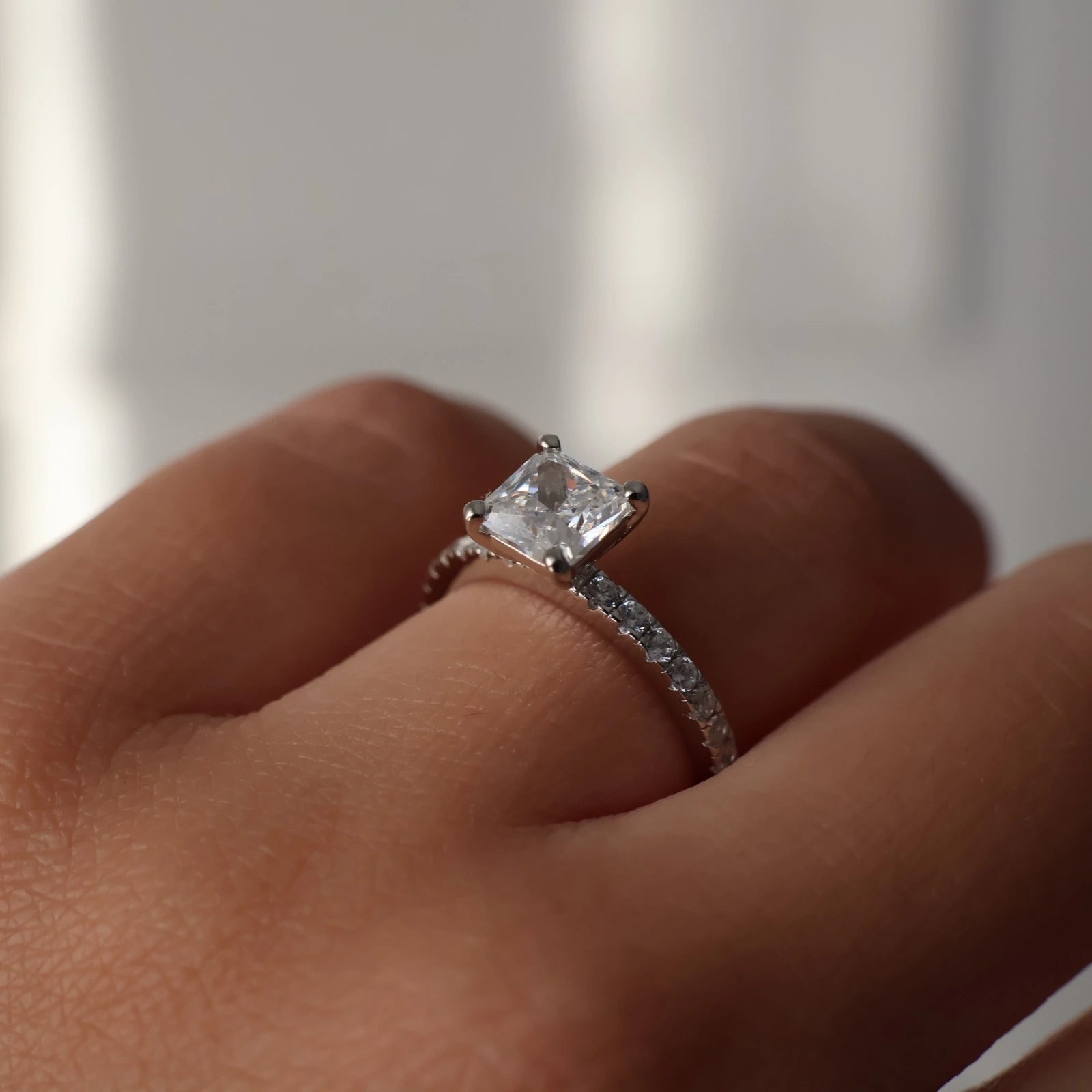 1.5ct princess cut ring in silver with pave band