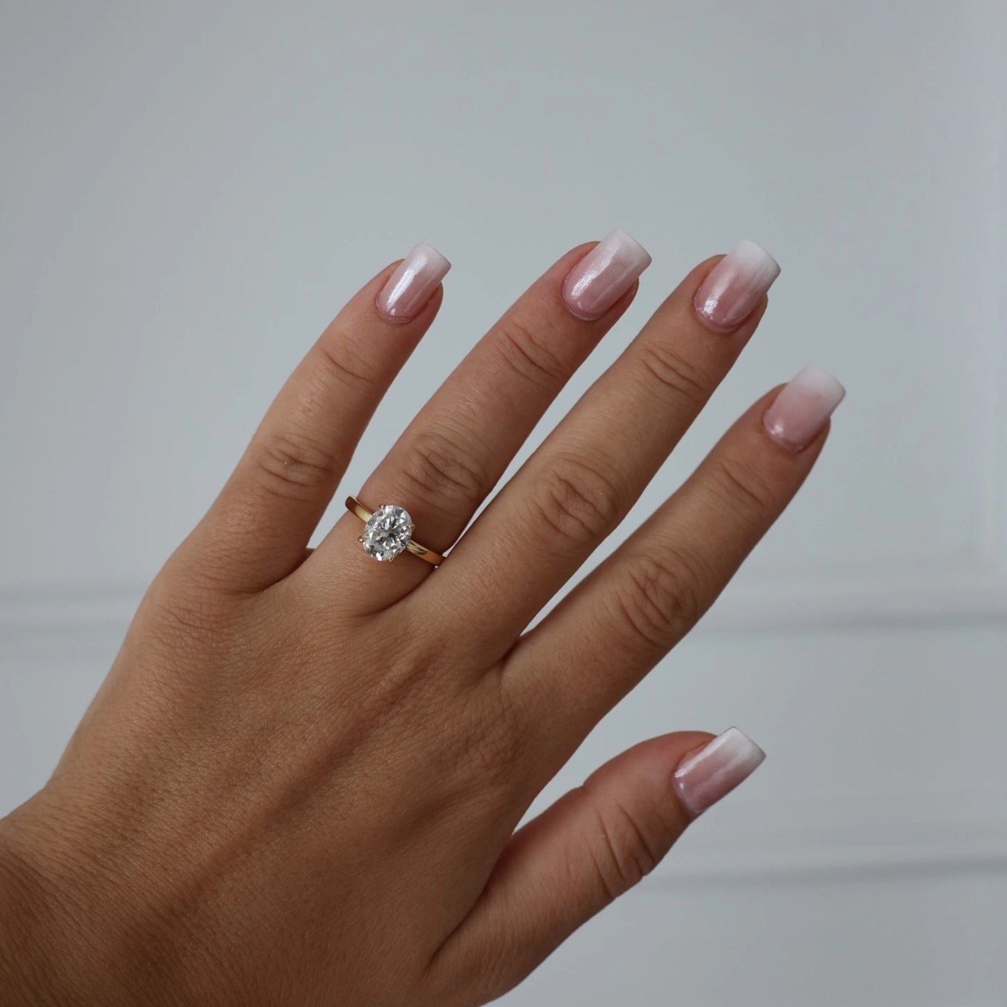 Close up view of 14k gold filled 2 ct oval moissanite solitaire ring