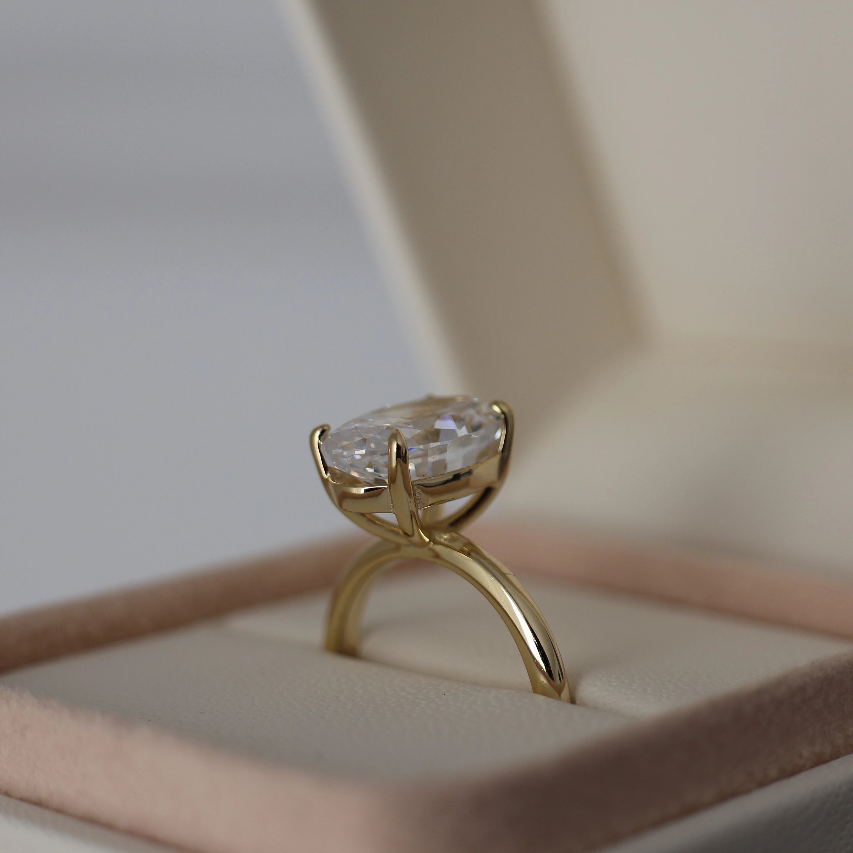 14k gold plated 3.5 ct oval cut cubic zirconia ring displayed in a proposal box