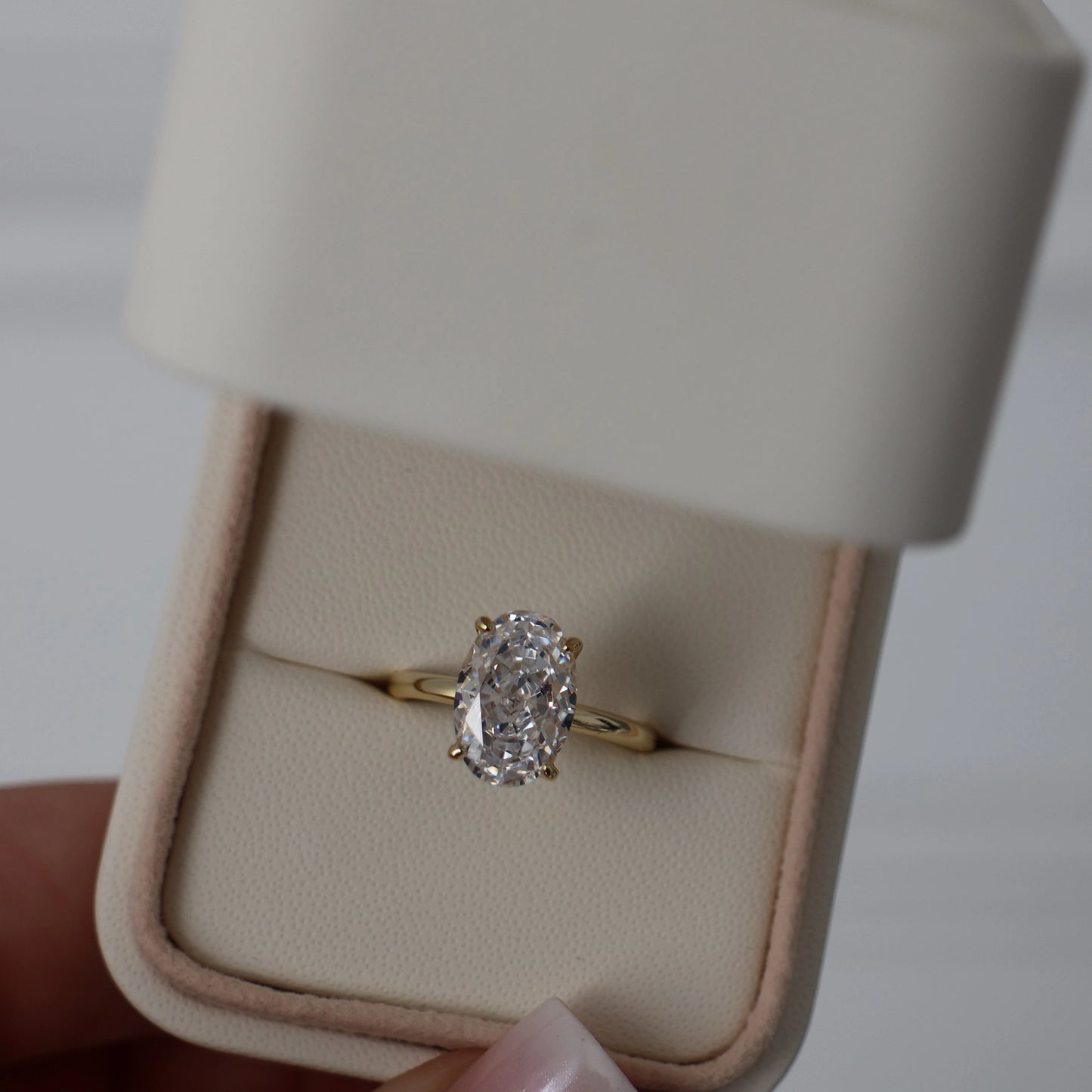 14k gold plated 3.5 ct oval cut cubic zirconia ring displayed in a proposal box