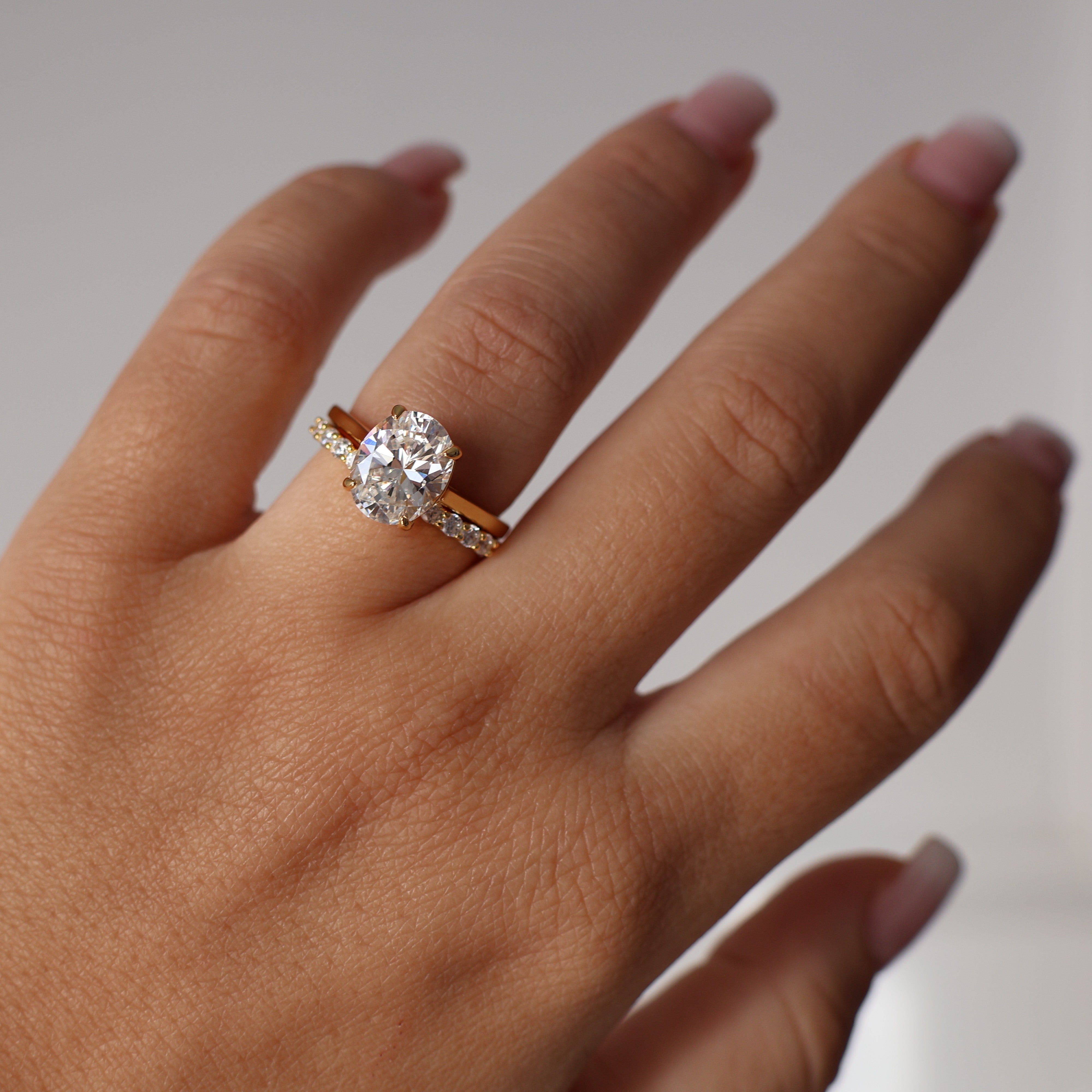 18k gold open wedding band with pavé cubic zirconia stones