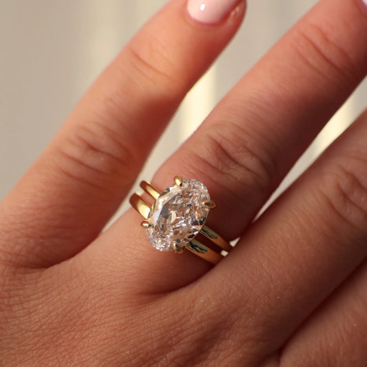 18K gold plated wedding ring stacked with an oval solitaire engagement ring
