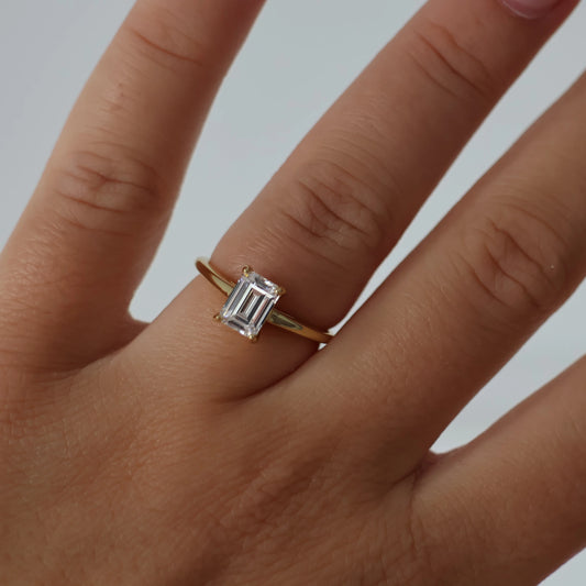 1 carat emerald cut solitaire ring in gold